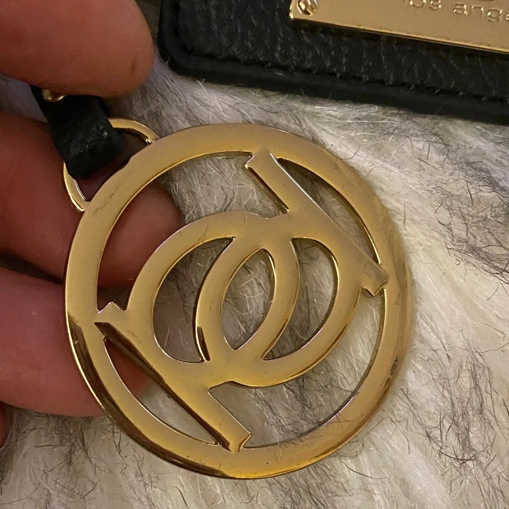 BEBE Black and Gold purse charm